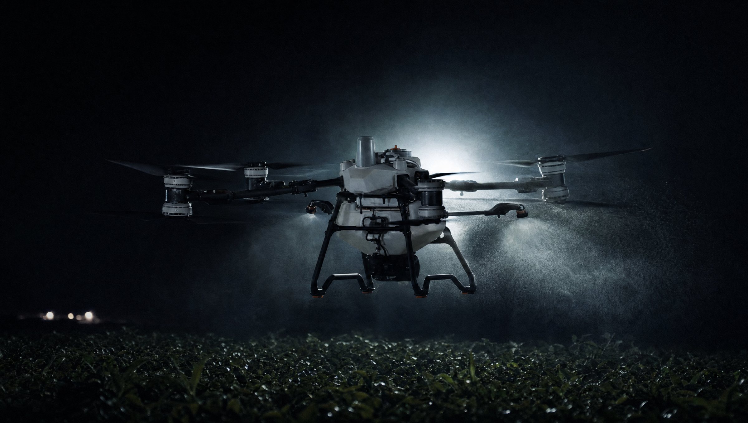 DJI Agras T100 spray drone at night